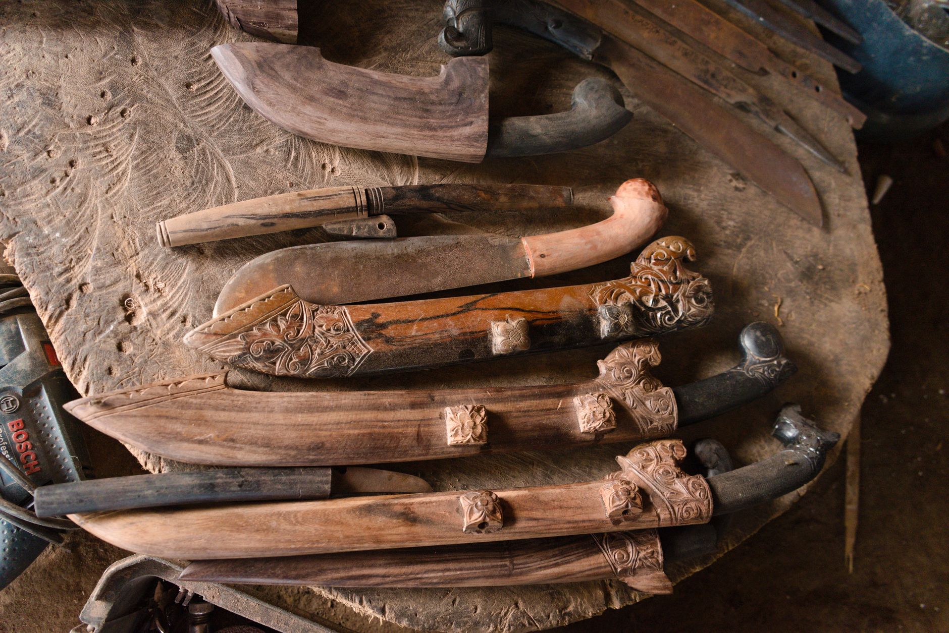 Exquisite handcrafted Sumbawa parang knives with intricate carvings, West Nusa Tenggara.